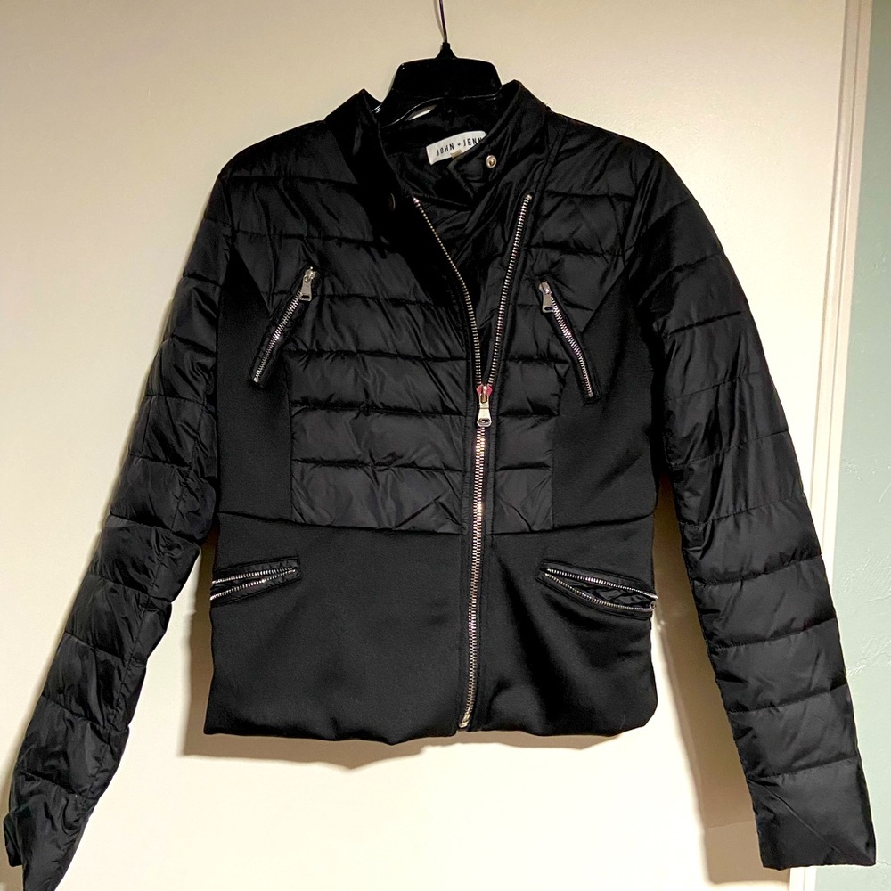 John + Jenn black puffer coat with unique zipper details.